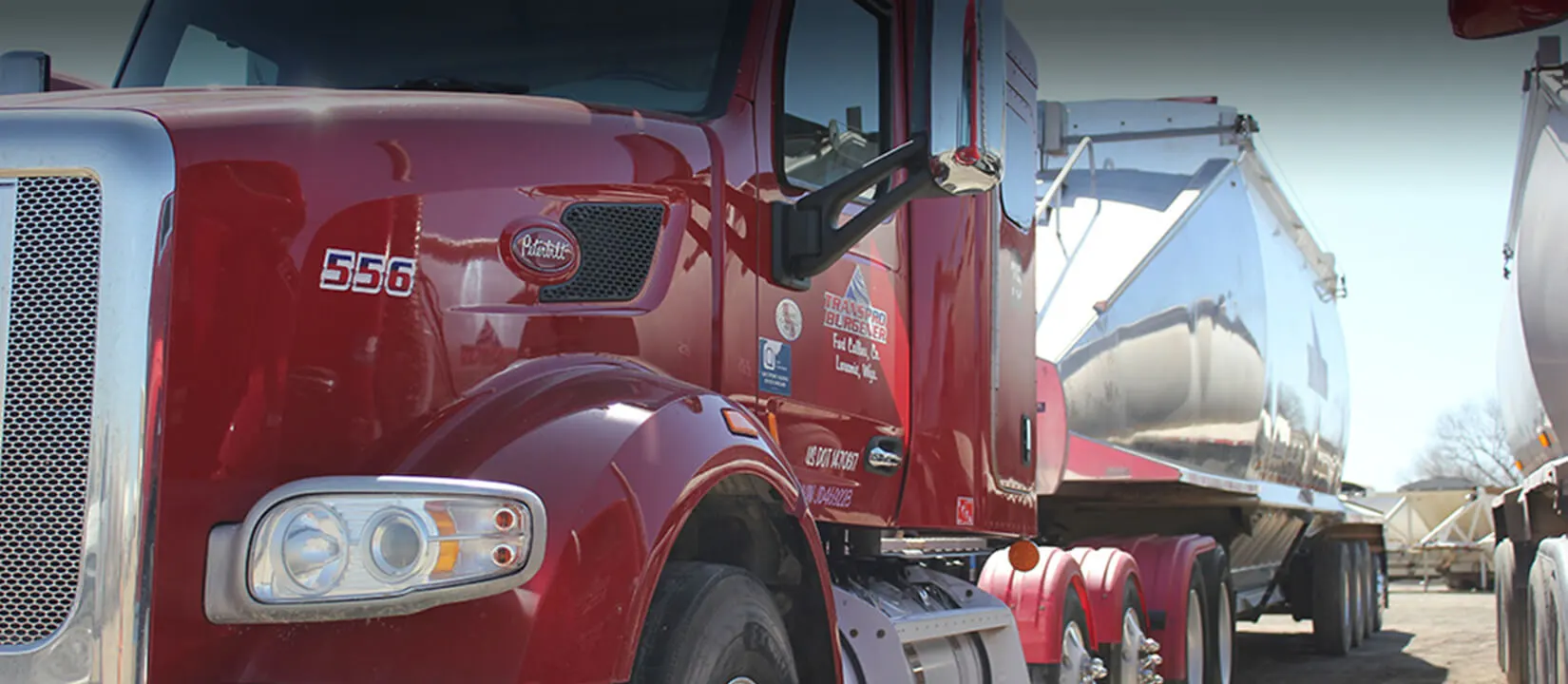 Close-up of a red TransPro Peterbilt with a chrome grille