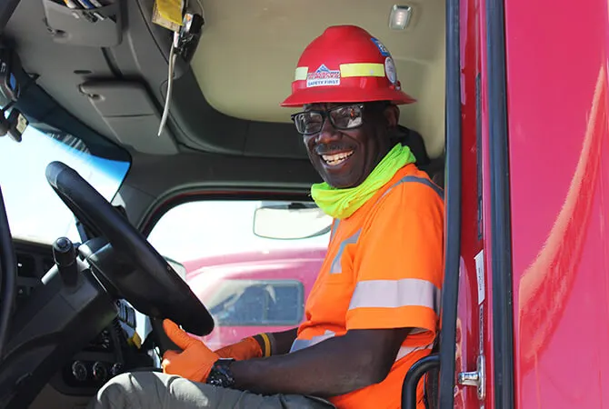 Driver in safety gear behind the wheel