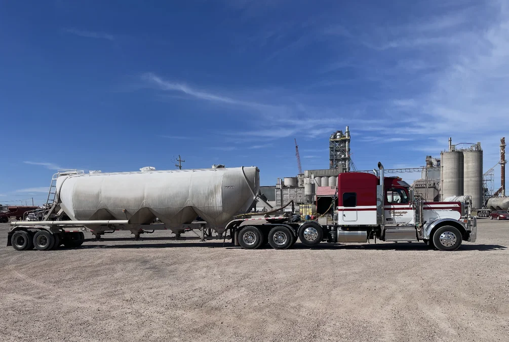 TransPro Peterbilt with a pneumatic dry bulk trailer at a cement plant