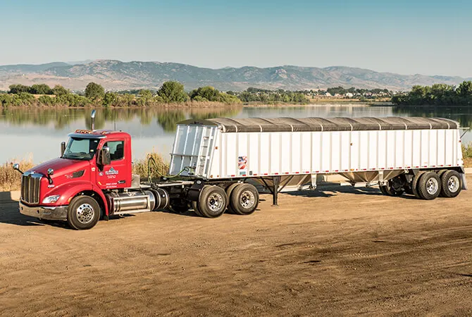Truck and trailer staged for rail transload
