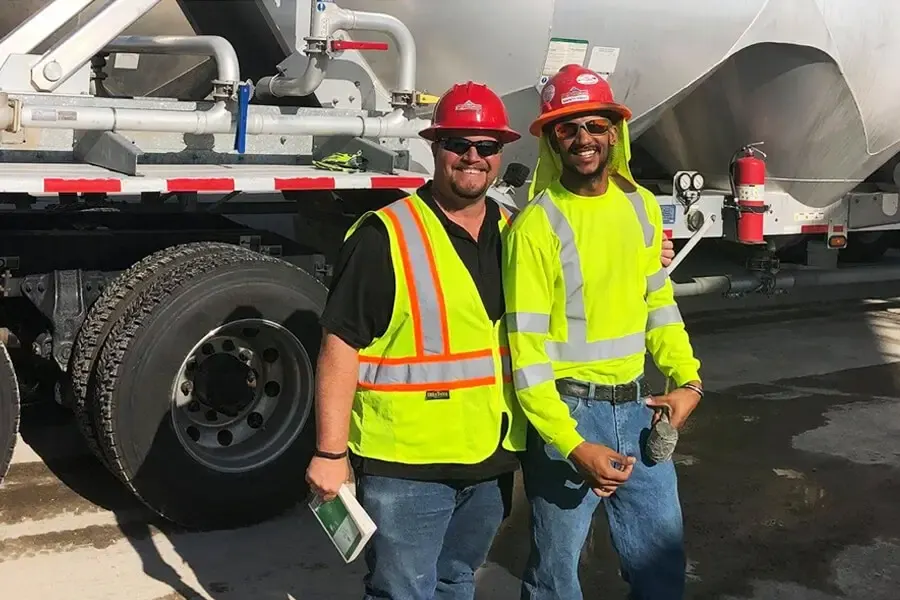 Two TransPro team members in safety vests